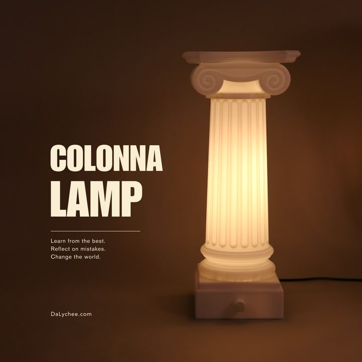 Colonna Lamp illuminated on a warm studio cover
