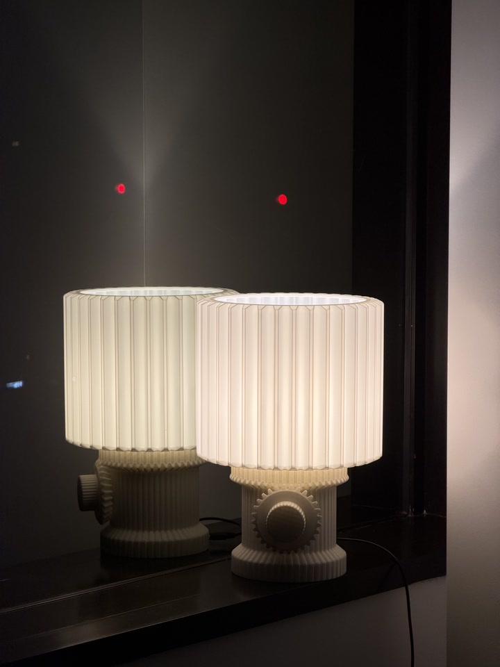 Gear Lamp and its reflection in a dark mirror