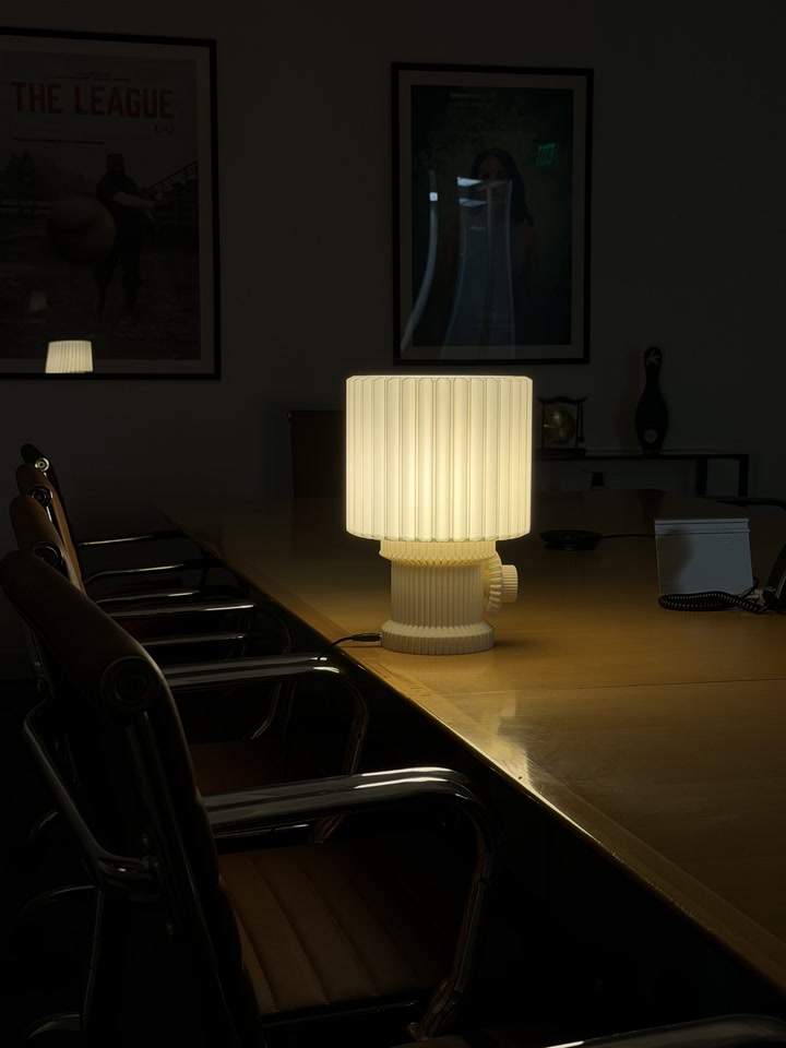 Gear Lamp glowing on a long dining table