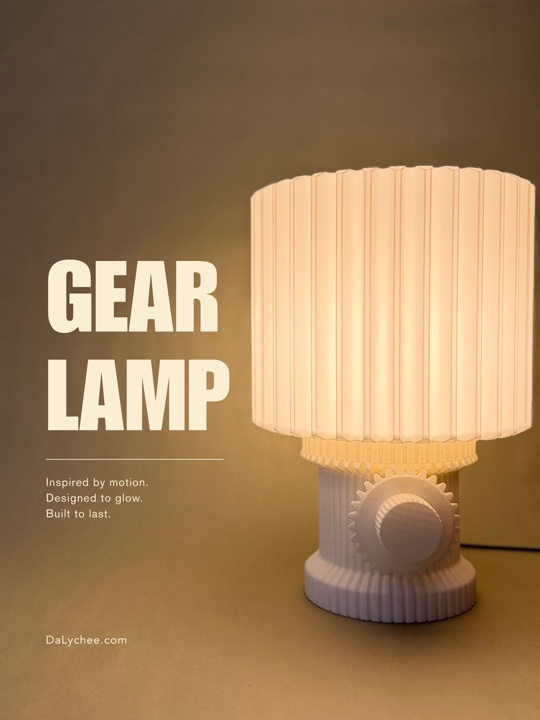 Gear Lamp glowing against a warm studio backdrop