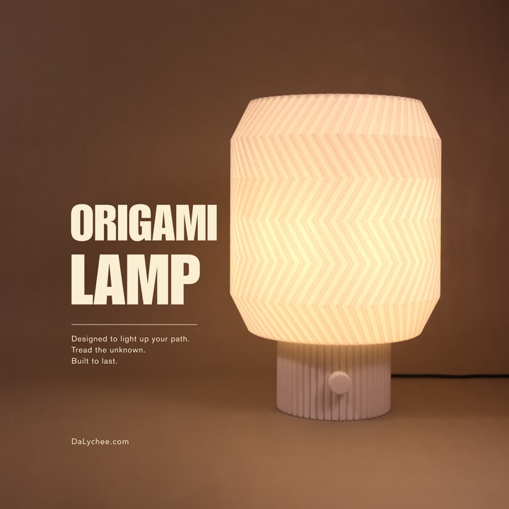 Origami Lamp illuminated on a warm studio cover