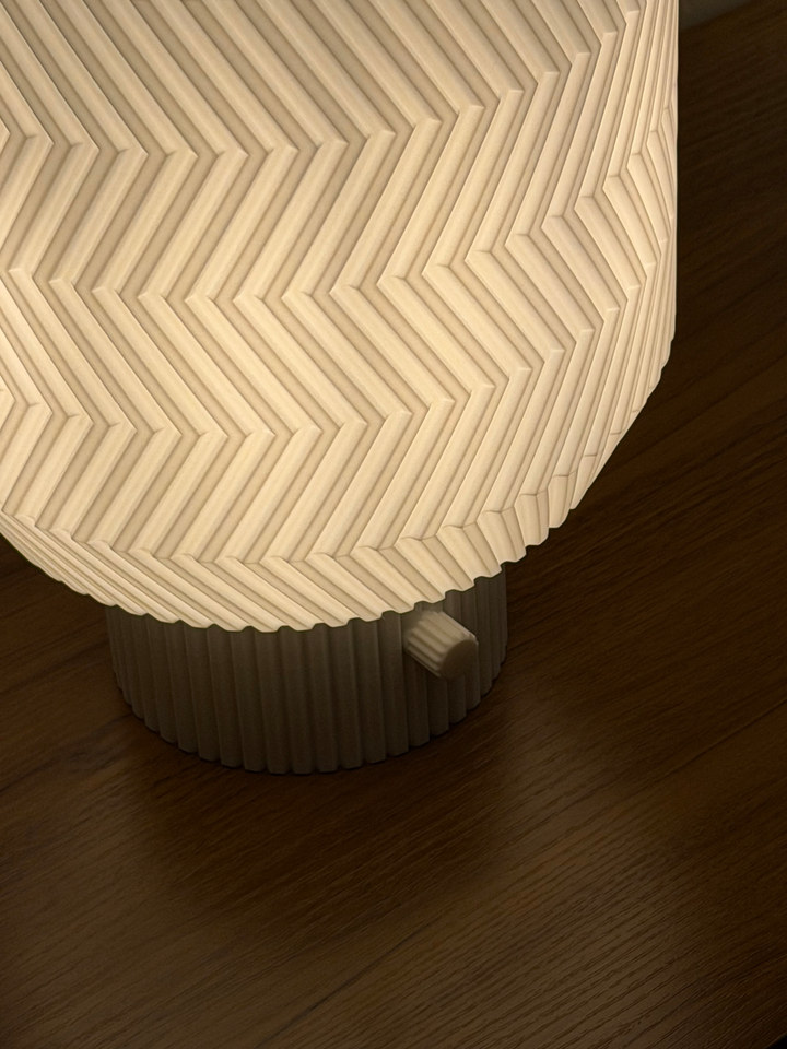 Overhead close view of the Origami Lamp folded-chevron shade