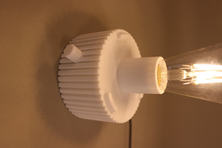 Close view of the Origami Lamp base and bulb