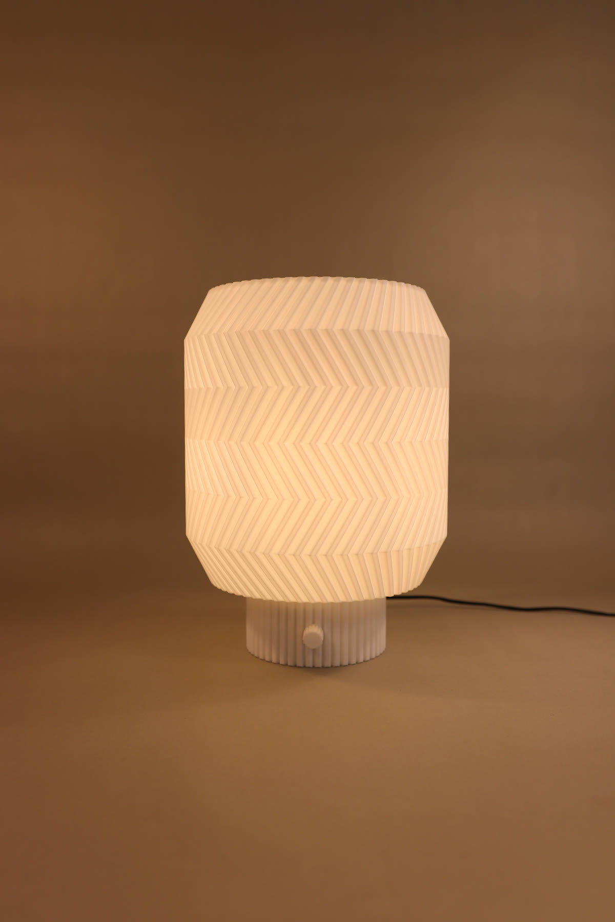 Origami Lamp glowing in warm light