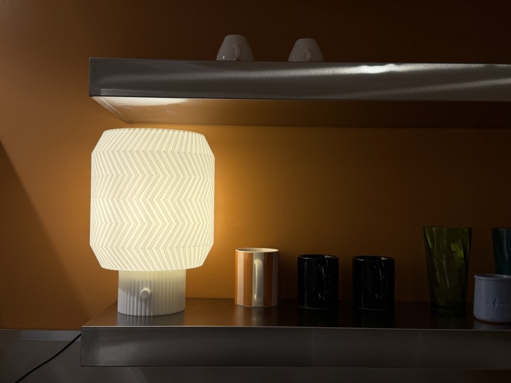 Origami Lamp glowing on a kitchen shelf