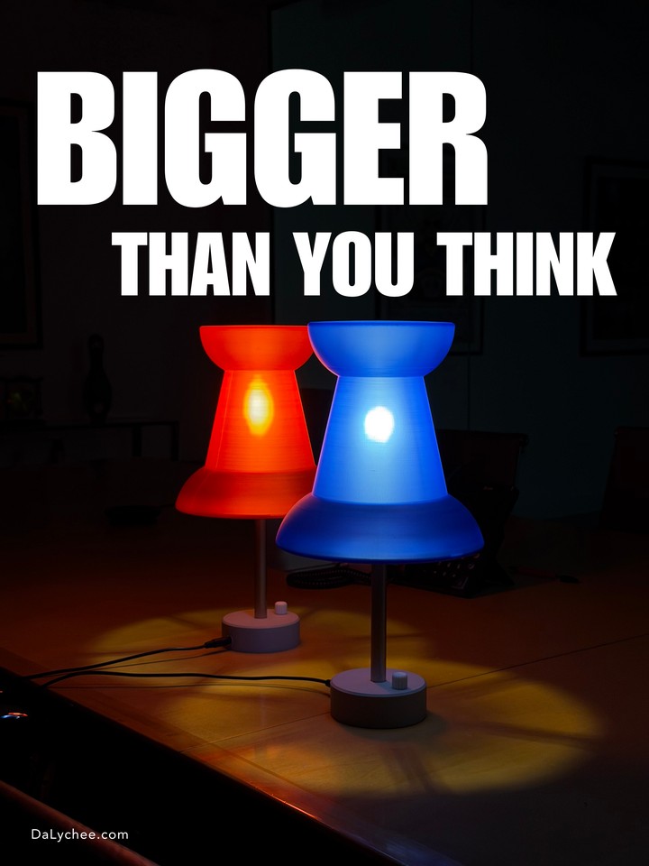 Red and blue Pushpin Lamps glowing beneath a Bigger Than You Think title