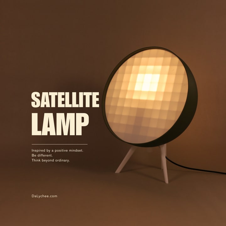 Satellite Lamp illuminated on a warm studio cover