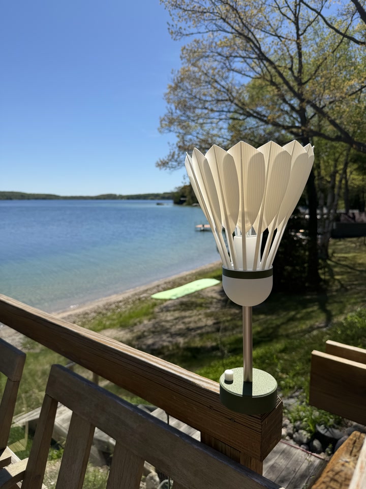 Shuttlecock Lamp on a lakeside deck