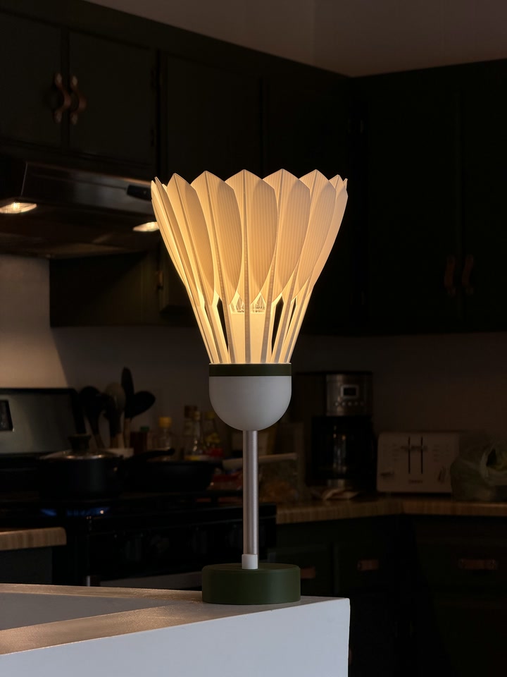 Shuttlecock Lamp glowing on a kitchen counter