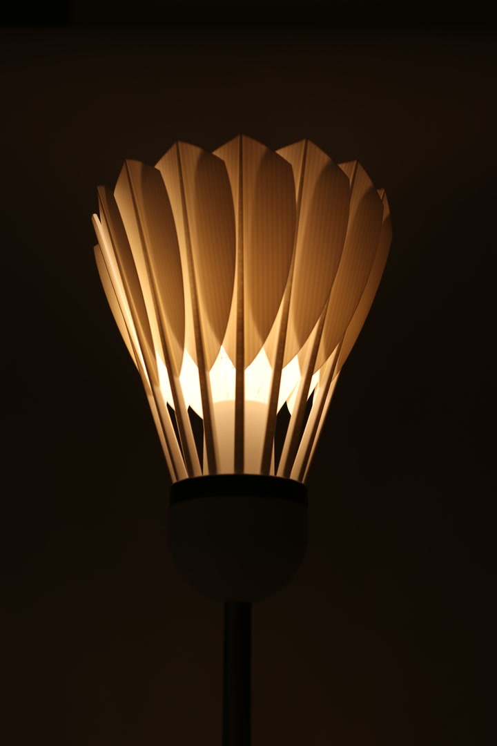 Front close-up of the illuminated Shuttlecock Lamp shade