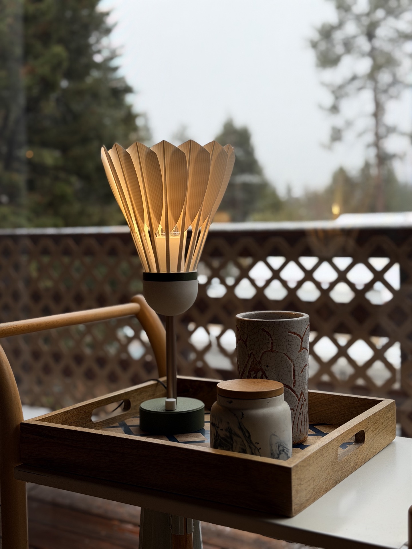 Shuttlecock Lamp in clean natural daylight beside a window